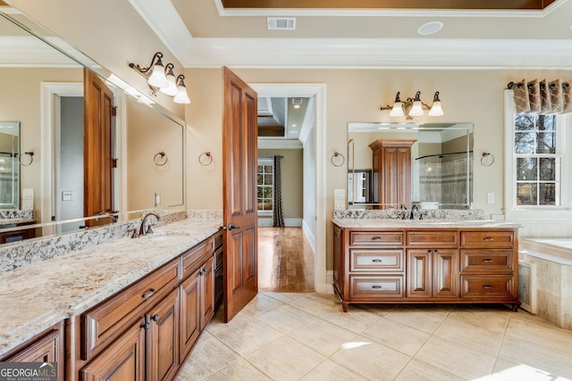 bathroom featuring separate shower and tub, vanity, and ornamental molding