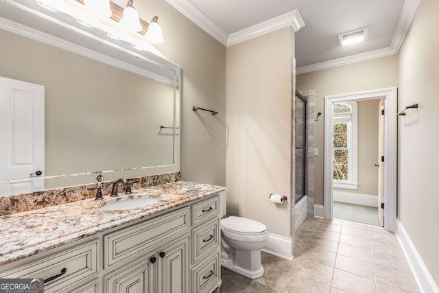 bathroom with tile patterned flooring, vanity, toilet, and ornamental molding