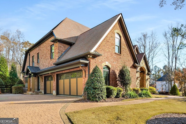 view of side of home with a garage