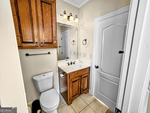 bathroom with ornamental molding, toilet, tile patterned flooring, and vanity