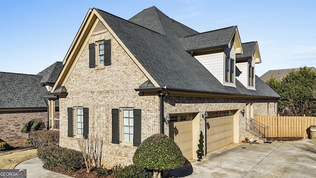 view of side of home featuring a garage