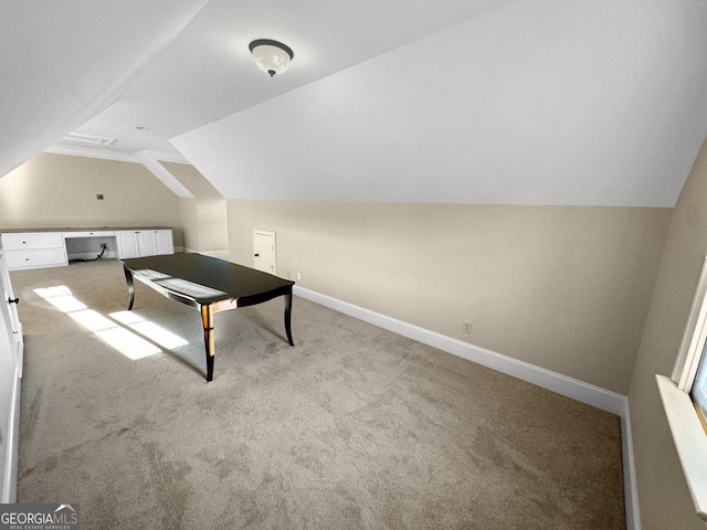 game room featuring lofted ceiling and light colored carpet