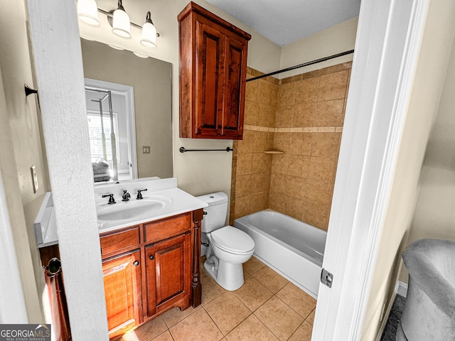 full bathroom with tiled shower / bath combo, vanity, tile patterned floors, and toilet