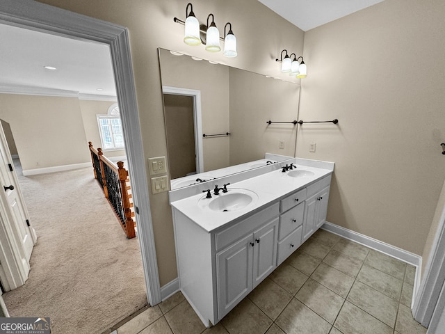 bathroom featuring ornamental molding, vanity, and tile patterned flooring