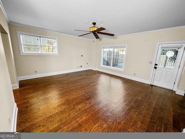 interior space featuring ornamental molding and dark hardwood / wood-style floors