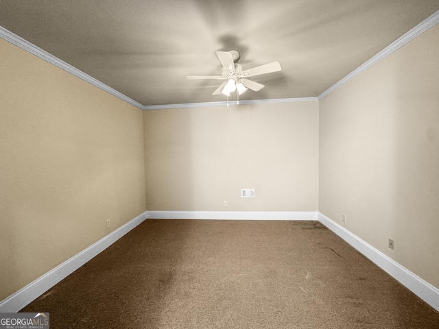 spare room with crown molding, ceiling fan, and carpet