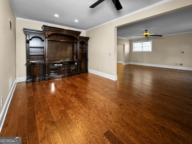 unfurnished living room with crown molding, dark hardwood / wood-style floors, and ceiling fan