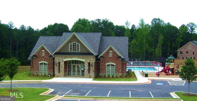 exterior space with french doors and a playground