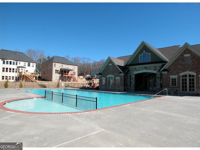 view of swimming pool with a patio