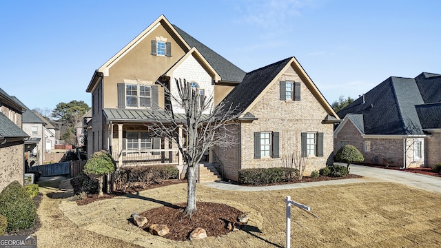 view of front of home with a front lawn and covered porch