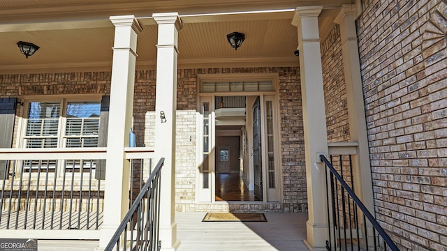 view of exterior entry with covered porch