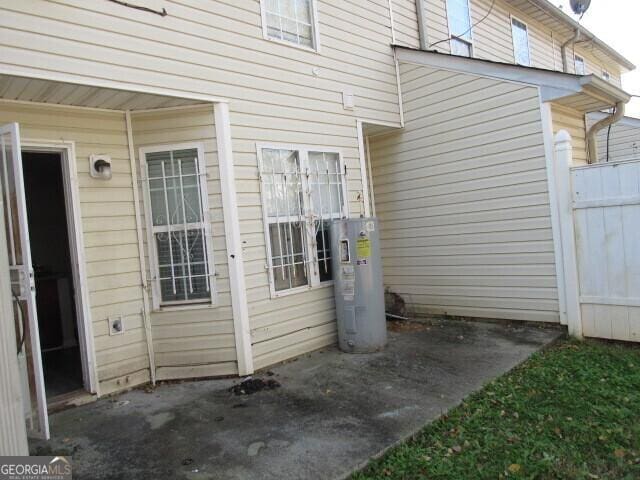 property entrance featuring water heater