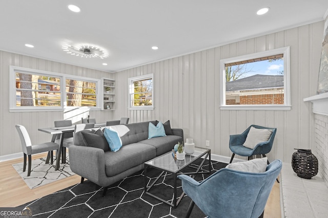 living room with a fireplace and wood-type flooring