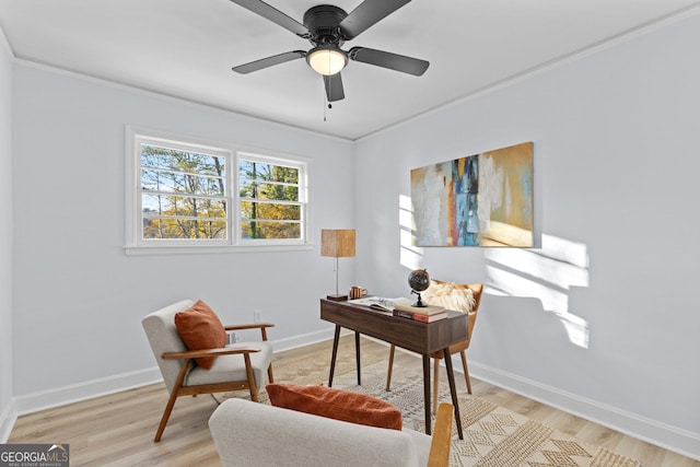 office area with crown molding, light hardwood / wood-style flooring, and ceiling fan