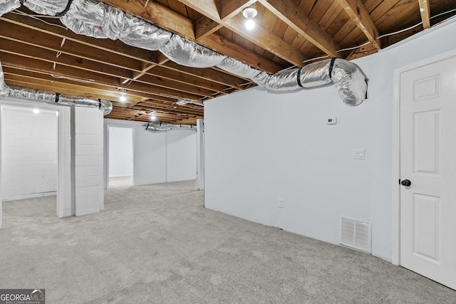 basement with light colored carpet