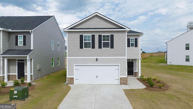 view of front of house featuring a front yard and a garage