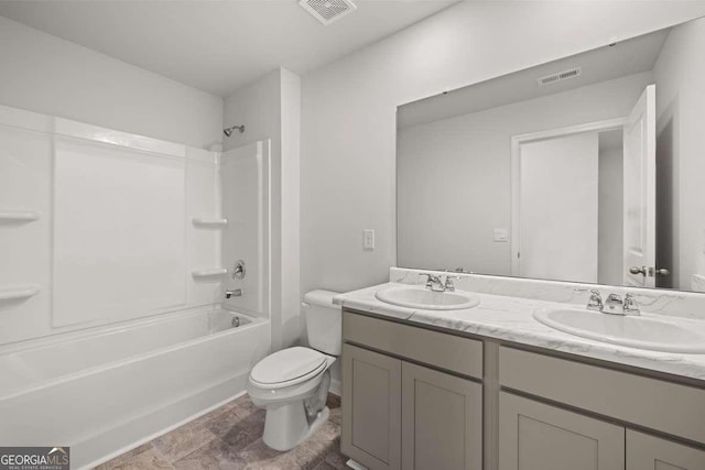 full bathroom with washtub / shower combination, vanity, and toilet