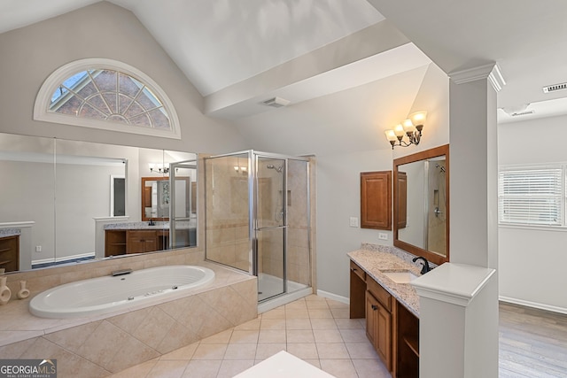 bathroom with a wealth of natural light, a shower stall, visible vents, and a sink