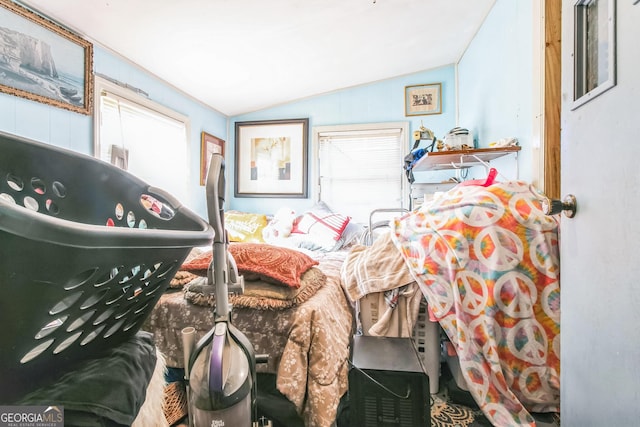 bedroom featuring lofted ceiling