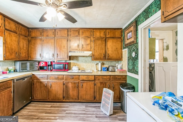 kitchen with dishwasher, crown molding, decorative backsplash, light hardwood / wood-style floors, and electric stovetop