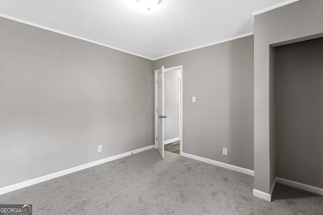 unfurnished bedroom with carpet flooring and ornamental molding