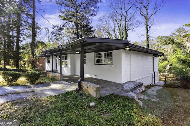 view of property exterior with covered porch