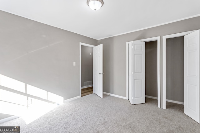 unfurnished bedroom with light carpet