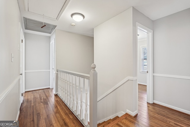 hallway with dark hardwood / wood-style floors