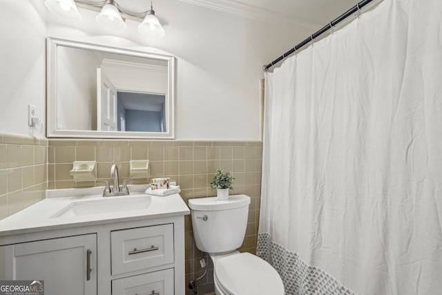 bathroom featuring vanity, a shower with curtain, crown molding, toilet, and tile walls