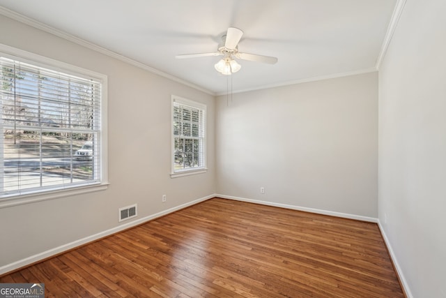 unfurnished room with hardwood / wood-style floors, ceiling fan, and ornamental molding