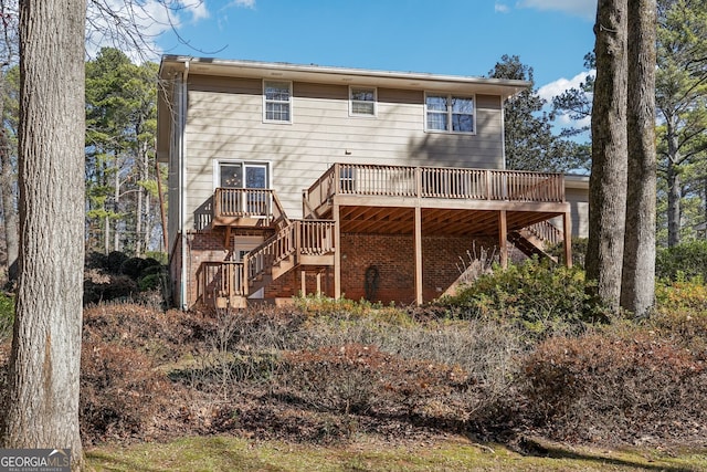 back of property with a wooden deck