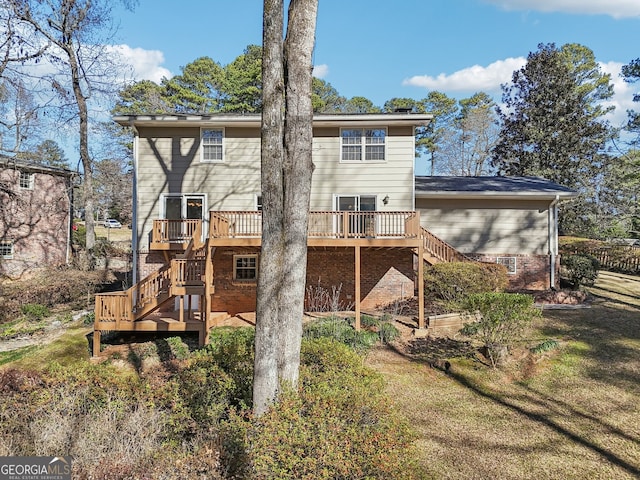 back of house with a yard and a wooden deck