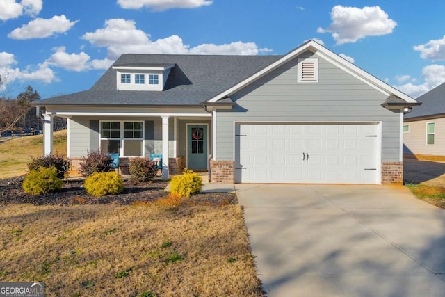 craftsman-style house with a garage, a front yard, and a porch