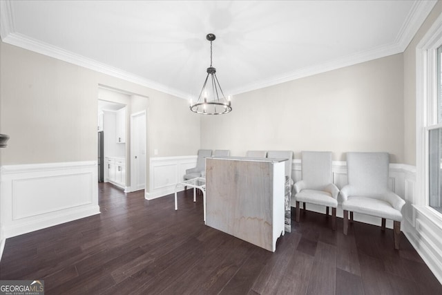 unfurnished dining area with ornamental molding, dark wood-type flooring, and an inviting chandelier