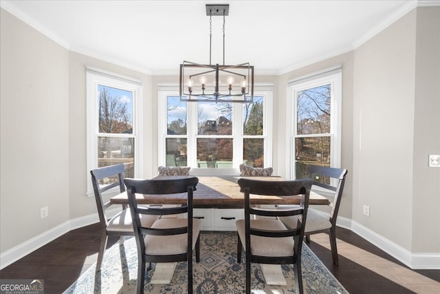 dining space featuring a chandelier, dark hardwood / wood-style floors, and crown molding