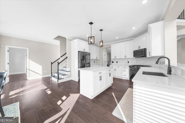 kitchen with white cabinetry, a center island, sink, electric range oven, and stainless steel fridge with ice dispenser