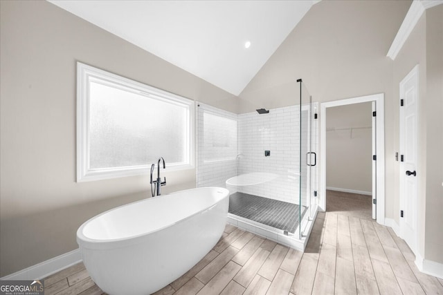 bathroom with plus walk in shower and vaulted ceiling