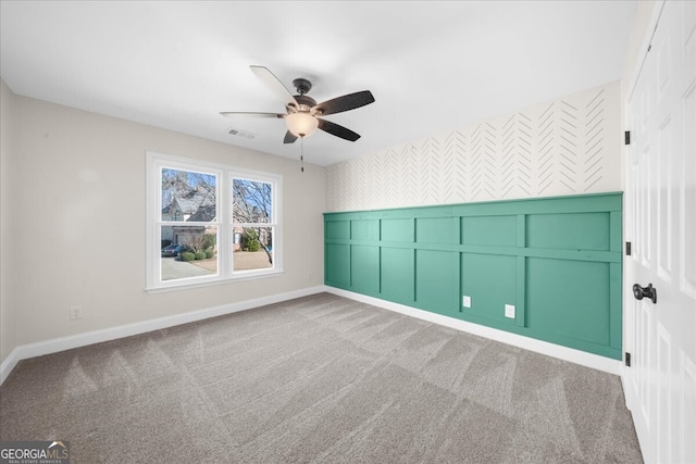 unfurnished bedroom with carpet flooring and ceiling fan