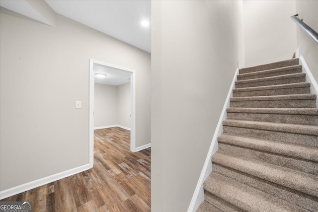 stairs with wood-type flooring