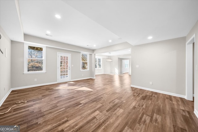 unfurnished living room with hardwood / wood-style flooring