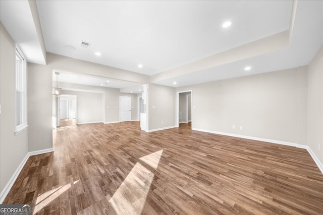 unfurnished living room with hardwood / wood-style flooring