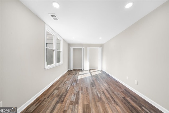 interior space with dark hardwood / wood-style flooring