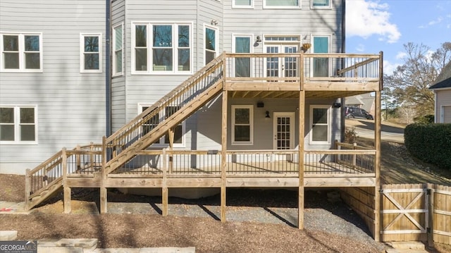 rear view of house with a wooden deck