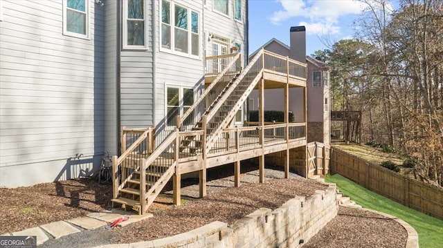 back of property featuring a deck