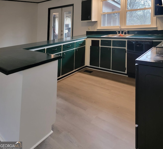 kitchen with dishwasher, sink, light hardwood / wood-style flooring, kitchen peninsula, and range