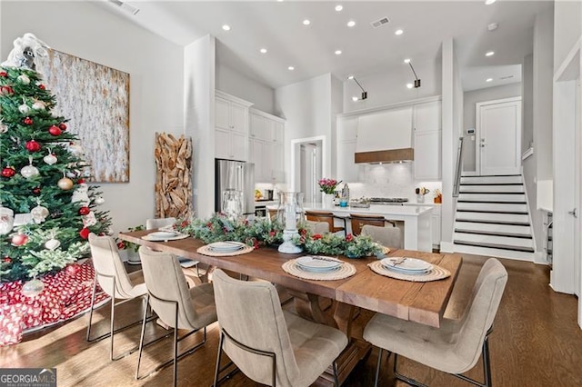 dining room with dark wood-type flooring