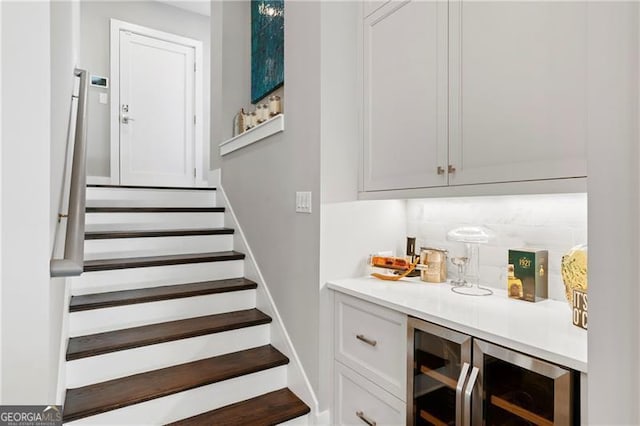 stairway with bar area and wine cooler