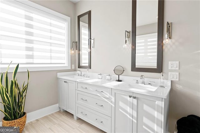 bathroom with vanity and wood-type flooring