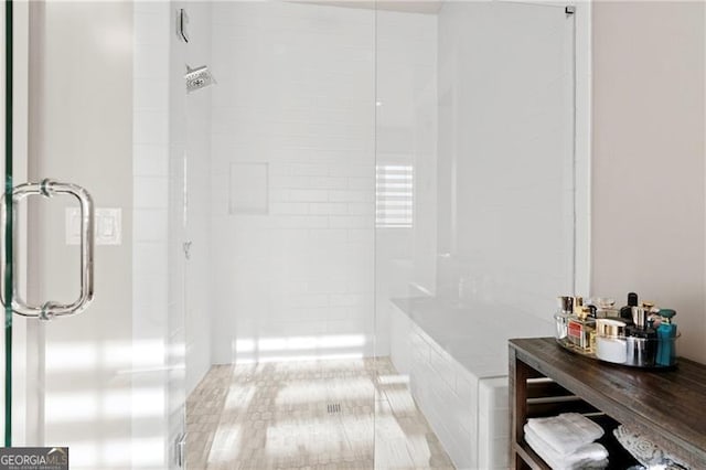 bathroom featuring an enclosed shower