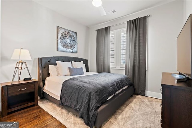 bedroom with ceiling fan and light hardwood / wood-style floors